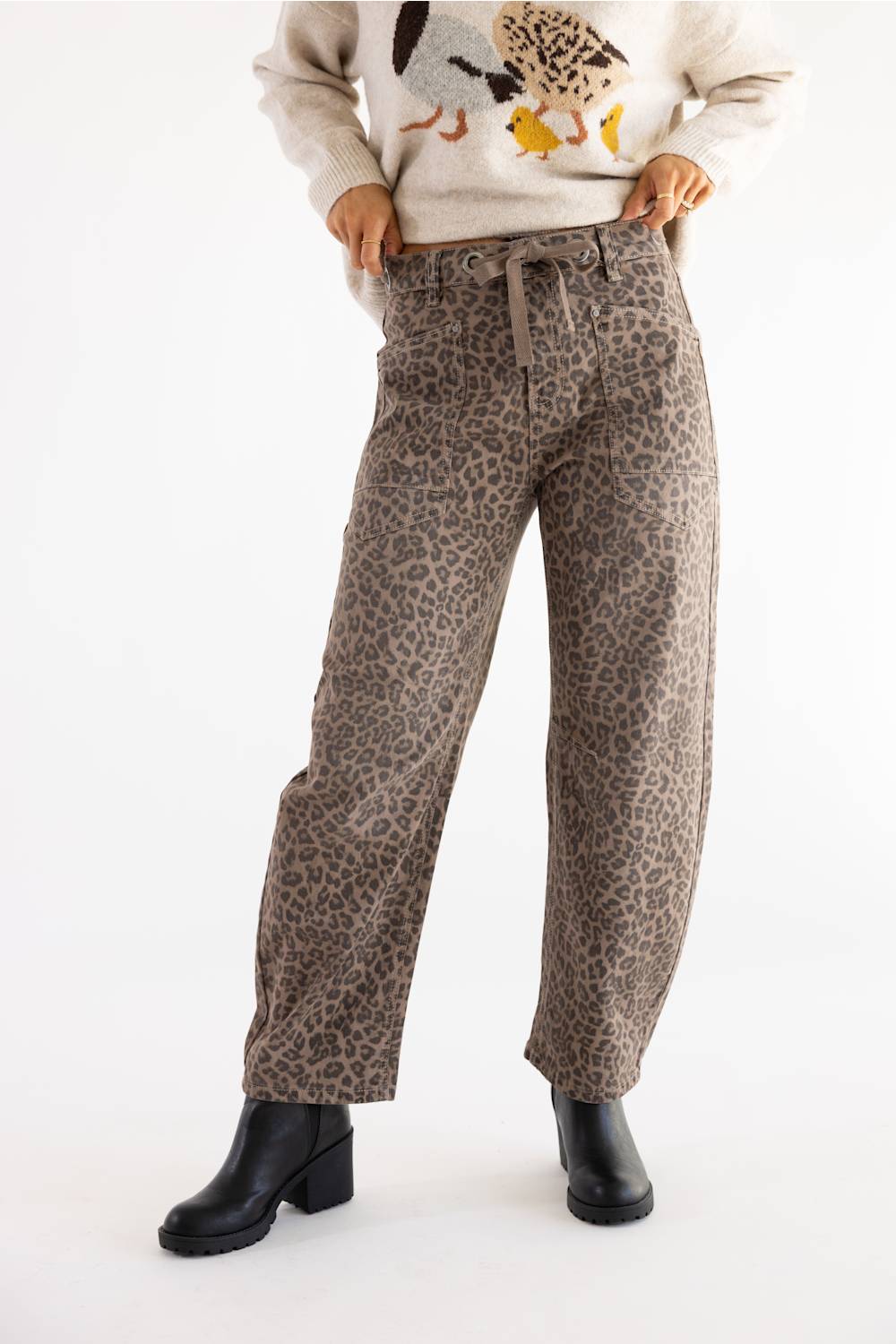 woman modeling cheetah print tie waistband barrel jeans