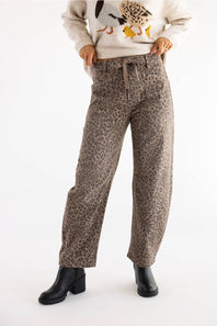 woman modeling cheetah print tie waistband barrel jeans