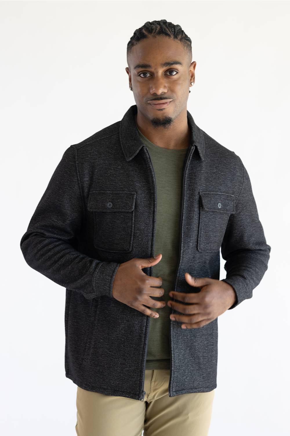 A man wearing a Hallstatt full zip Knit Jacket for Men in Charcoal Grey with two chest pockets.