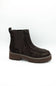 A dark brown suede Chelsea boot with a chunky lug sole, shown from a side profile on a white background.