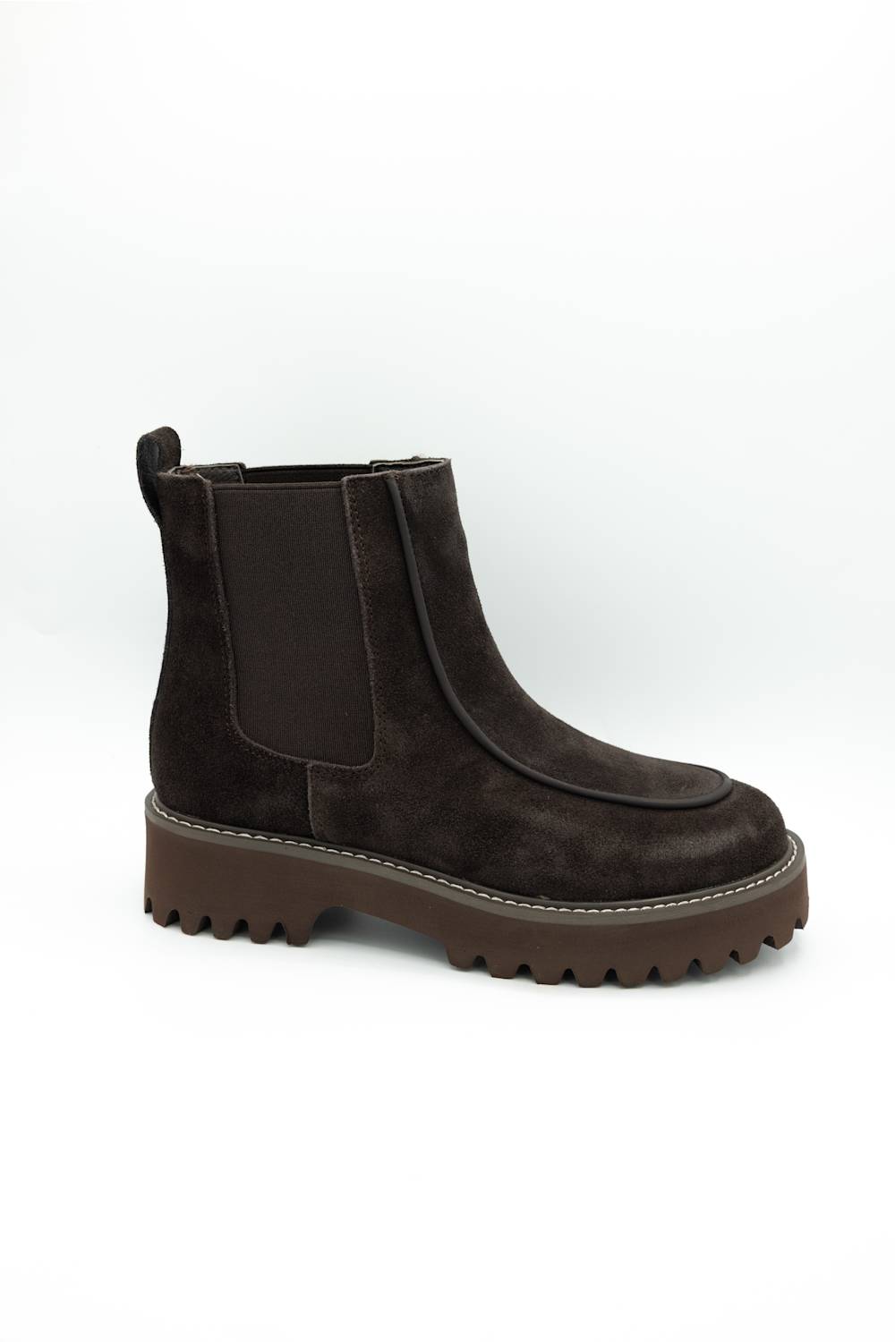 A dark brown suede Chelsea boot with a chunky lug sole, shown from a side profile on a white background.