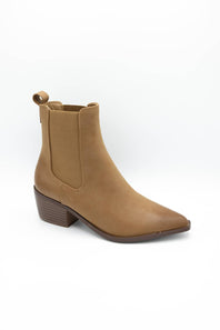 A tan suede ankle boot with a pointed toe, elastic side gore, and a low stacked block heel, shown on a white background.