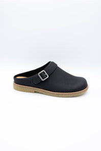 A black leather clog shoe with a single strap and a silver buckle, shown from a side profile on a white background.