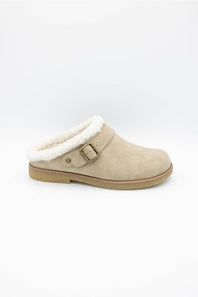 A single beige suede slip-on clog shoe with a white shearling lining and a brown buckle strap, shown against a plain white background.
