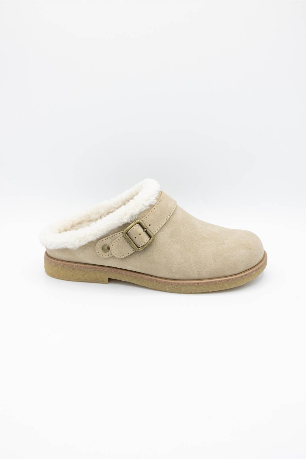 A single beige suede slip-on clog shoe with a white shearling lining and a brown buckle strap, shown against a plain white background.