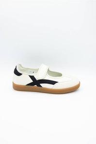 A single white low-top sneaker with a black side stripe and a brown gum sole, photographed from the side against a plain white background.