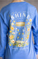 A person wearing a blue long-sleeve shirt, shown from the back. The shirt features a large graphic print of a mason jar surrounded by yellow and white flowers, with the text 'Let Your Light SHINE' and 'simply southern COLLECTION'.