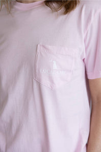Local Girl Absolute Localflage T-Shirt for Women in Blossom; Pink t-shirt with a logo on the chest worn by a person