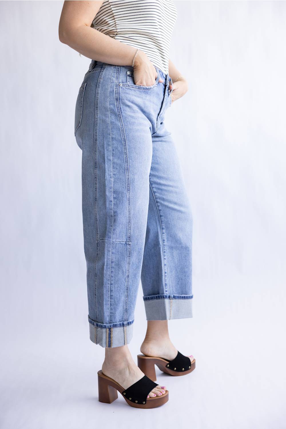 Mica High Rise Cuffed Barrel Jeans for Women; Person wearing light blue jeans and a striped top on a white background