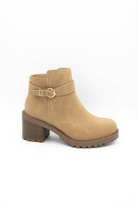 A tan suede ankle boot with a side buckle strap and a chunky block heel, shown from a side profile on a white background.