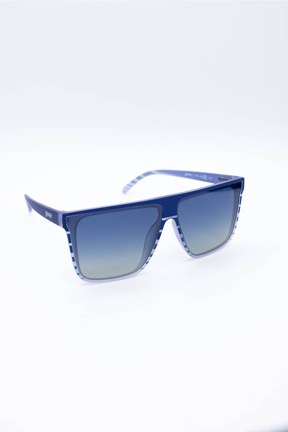 Blue gradient sunglasses with a translucent blue frame and blue-to-gray gradient lenses, shown on a white background.