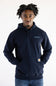 A man wearing a navy blue Carhartt pullover hoodie with the brand name printed in light blue on the left chest and the signature Carhartt patch on the front pocket, set against a plain white background.