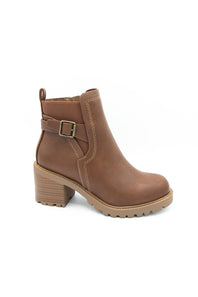 A brown leather ankle boot with a block heel, a side buckle strap detail, and a lug sole, shown on a plain white background.