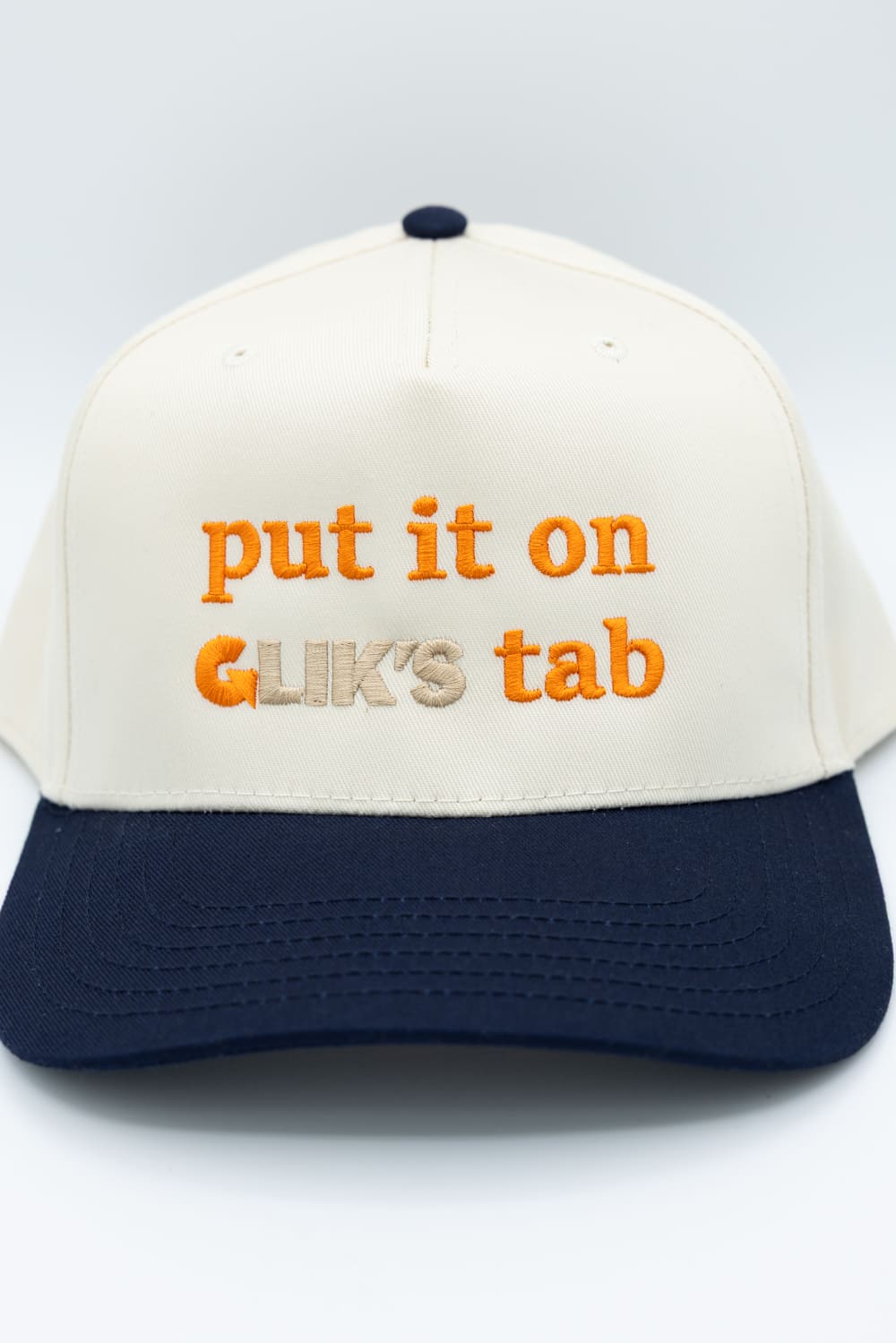 Put It On Glik's Tab Trucker Hat for Women in Navy/Tan