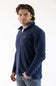 A man wearing a navy blue microfleece quarter zip pullover with a Patagonia logo on the upper left chest.