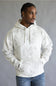 A man wearing a white and gray camo pattern hoodie with blue jeans, standing against a neutral gray studio background.