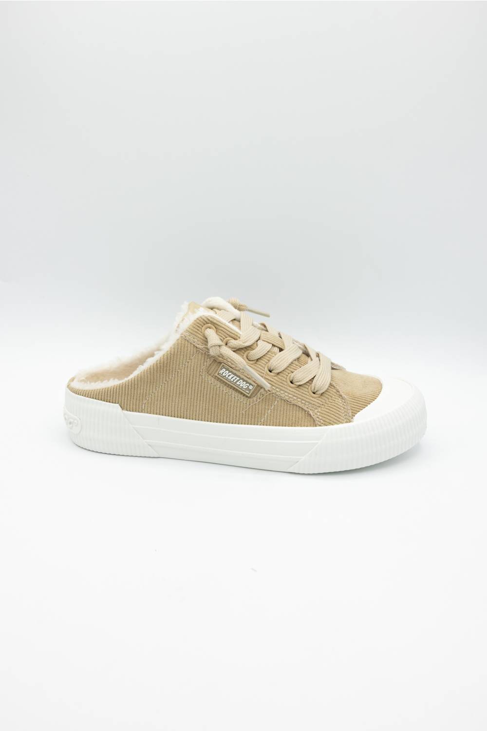 A single low-top slip-on sneaker in beige canvas with a white rubber sole, shown from the side on a light gray background.