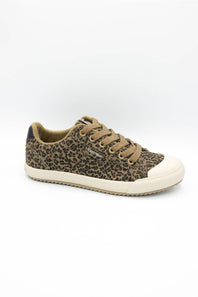 A low-top canvas sneaker featuring a brown and black leopard print pattern, tan laces, and a thick cream rubber toe cap and sole, shown against a plain white background.