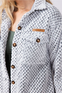 Soft fleece button up shacket with cuffs, and tortoiseshell buttons and chest pockets 