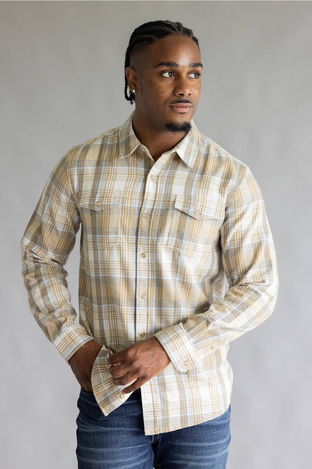 Torso-up view of the Split Flannel Shirt for Men in Beige paired with denim jeans.