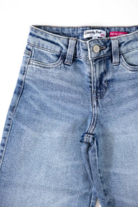Close-up of light blue denim jeans showing the waistband, belt loops, button, front pockets, and fly area on a white background.