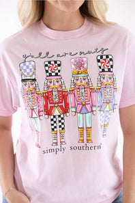 Blonde woman modeling a shirt that reads "yall are nuts" with nutcrackers below it 