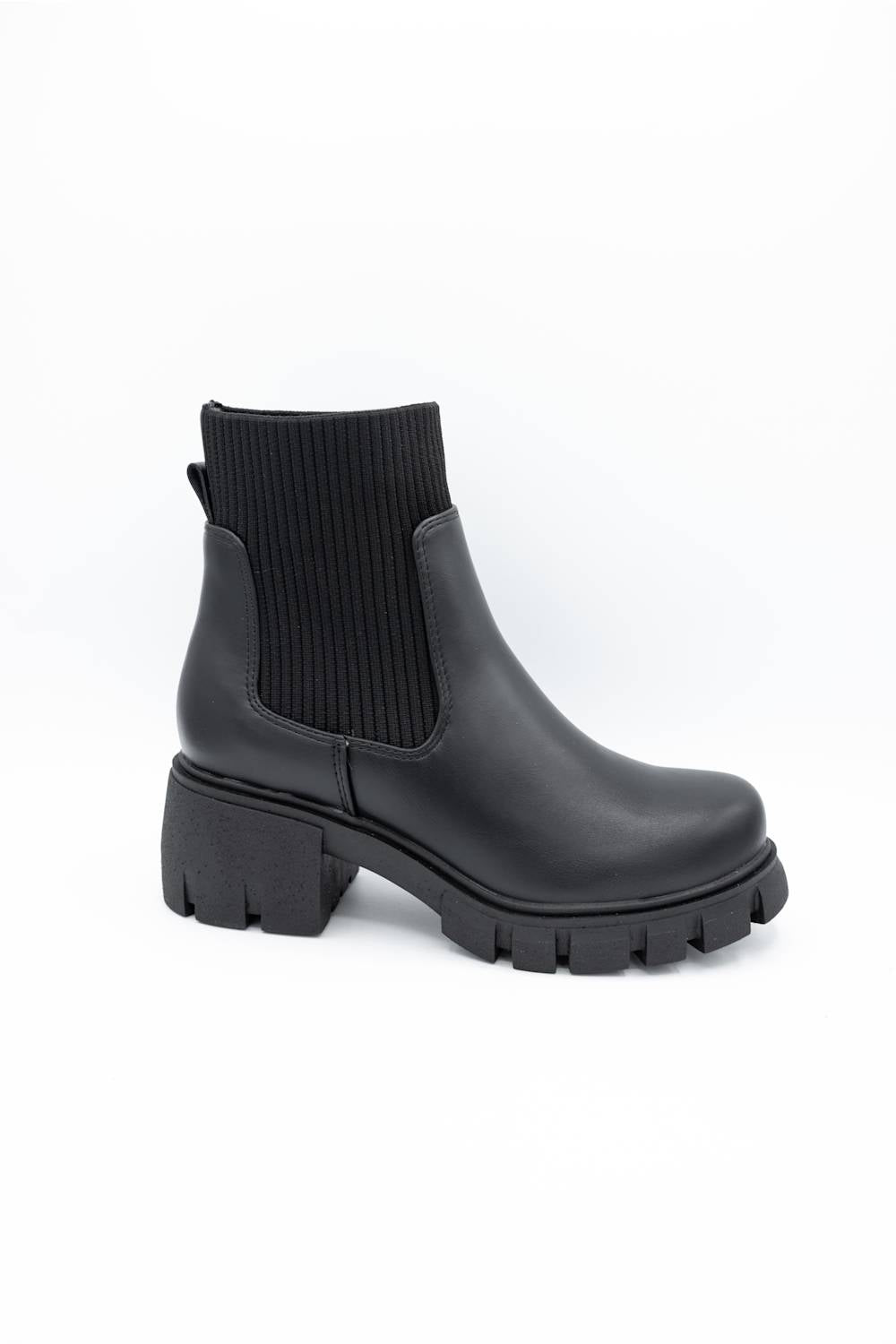 A single black ankle boot with a ribbed elastic side panel and a chunky lug sole, photographed on a clean white background.