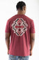 A man viewed from behind wearing a heathered red t-shirt with a large geometric patterned back graphic that features the brand name 'ARIAT' in red, and blue jeans, against a plain white background.