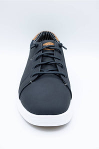 A pair of low-top casual sneakers in black, with one shoe standing upright to show the tan textured outsole and the other lying flat to show the side and black laces, set against a plain white background.