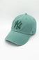 Green baseball cap with a logo on a white background