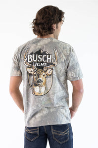 Back view of a man wearing a camo JEDCo t-shirt featuring a large Busch Light logo above a whitetail deer graphic printed on the back.