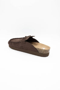 A single dark brown suede mule slipper shown from a side-rear angle on a plain white background.