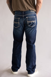 Ariat M5 Slim Stretch Coltrane Straight Leg Jeans for Men; Person wearing blue jeans on a plain background