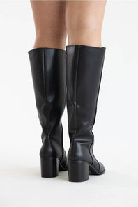 Black knee-high leather boots with block heels, shown from the back on a model against a white studio background.