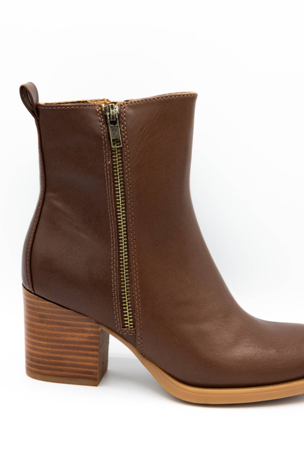 A brown leather ankle boot with a side zipper, a stacked wood-look block heel, and a light tan outsole, shown against a plain white background.