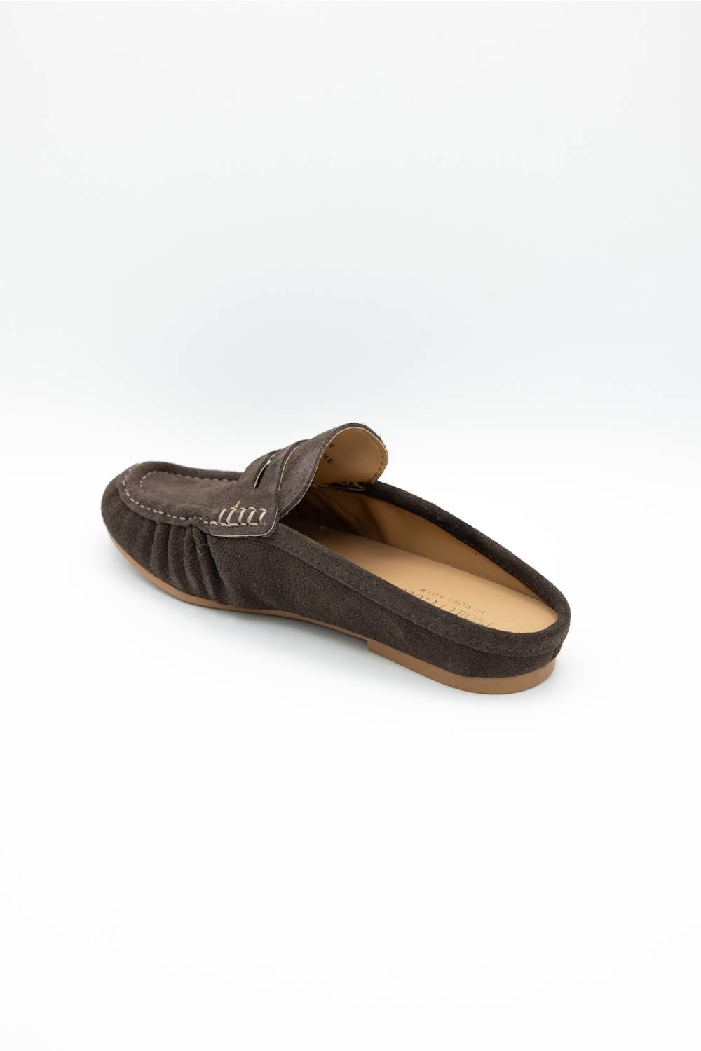 A single dark brown suede slip-on loafer mule shown from a three-quarters angle on a white background.