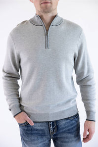 Close-up view of the F/X Fusion platinum gray birdseye knit quarter-zip sweater, highlighting the mock neckline, black contrast piping, and textured fabric.