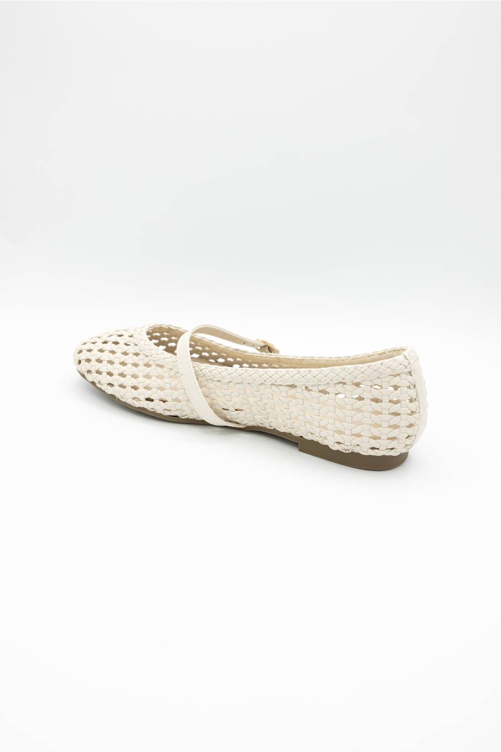 A single cream-colored woven mesh Mary Jane flat shoe with a small gold buckle, shown on a light gray studio background.