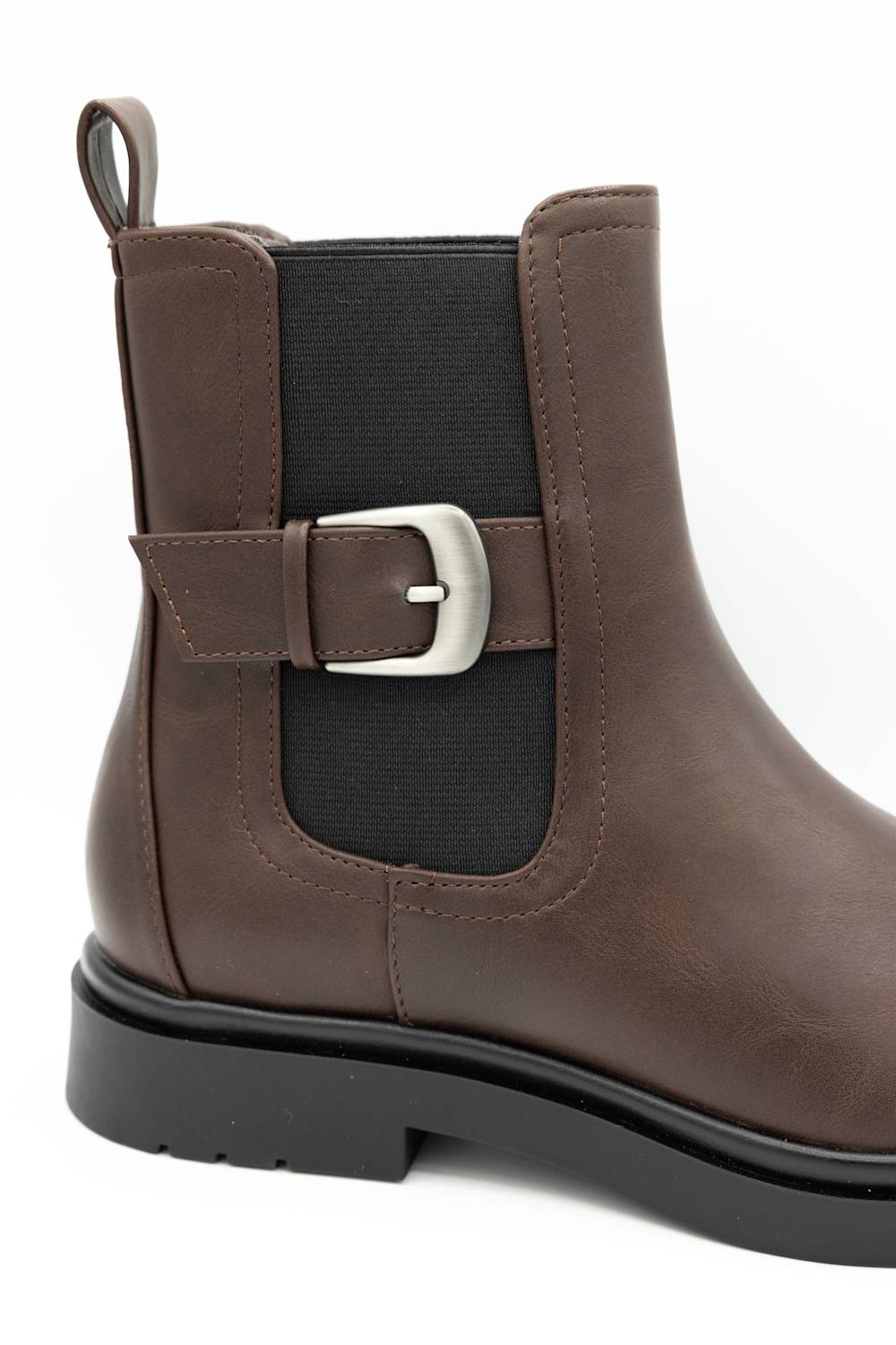 side profile of a chelsea boot with side gore with buckle