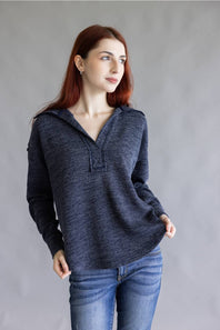 Ribbed v-neck sweater top with long sleeves and exposed seams