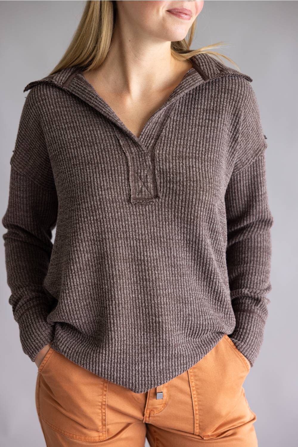 Long sleeve ribbed top in brown, with a deep collar v-neckline 