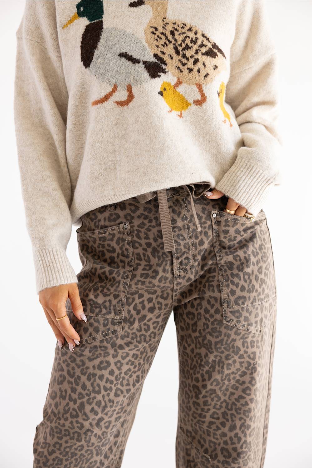 woman modeling cheetah print tie waistband barrel jeans