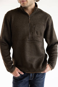 A man wearing the Hallstatt Fleece Quarter Zip Pullover for Men in Heather Brown with a full zip front, knit-like material, vertical zipper pocket on the chest, and front hand pockets.
