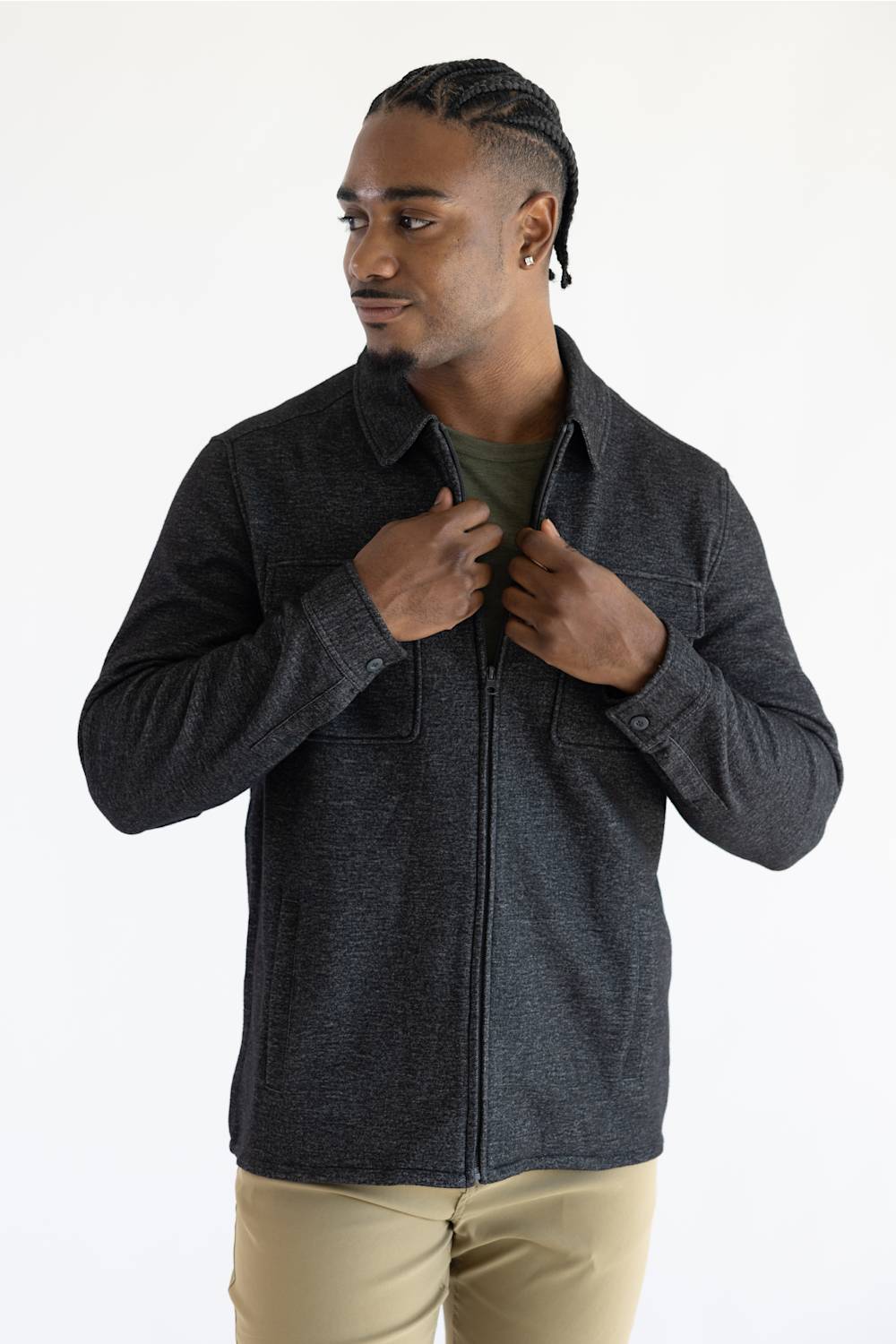 A man wearing a Hallstatt full zip Knit Jacket for Men in Charcoal Grey with two chest pockets.