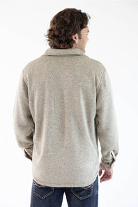 A photo of a man from the back wearing a snap up Hallstatt Sherpa Lined Shacket for Men in Oatmeal Heather with two chest pockets.