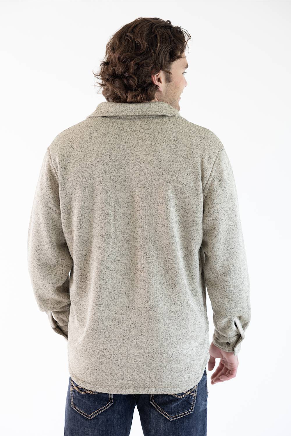 A photo of a man from the back wearing a snap up Hallstatt Sherpa Lined Shacket for Men in Oatmeal Heather with two chest pockets.