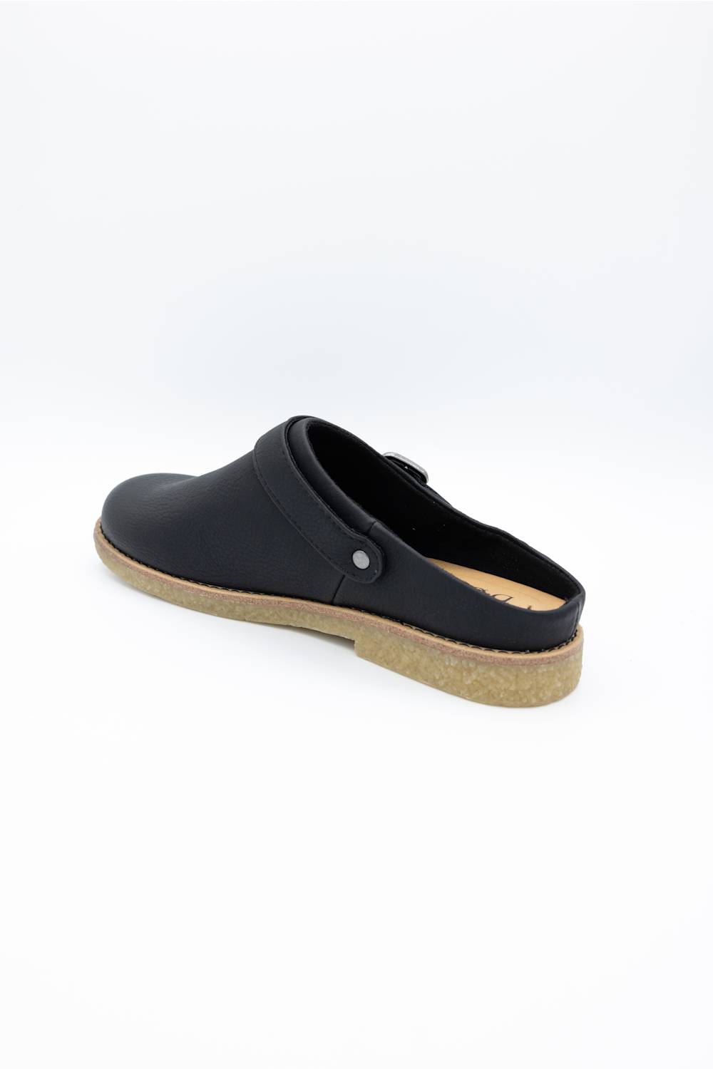 A black leather clog shoe with a cork-look midsole and a small silver metal snap button, shown from a side-rear angle on a white background.