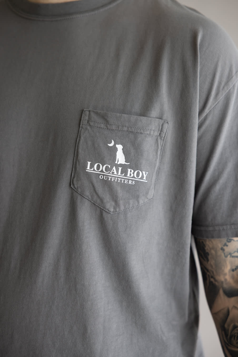 Local Boy Vintage Emblem T-Shirt for Men in Grey; Gray t-shirt with a pocket featuring 'Local Boy Outfitters' logo.