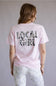 Local Girl Absolute Localflage T-Shirt for Women in Blossom; Person wearing a pink t-shirt with camo print text on the back against a plain background