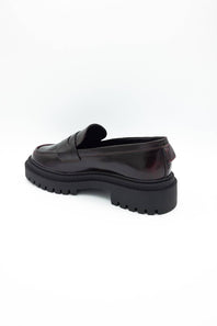 MIA Henrik Platform Loafers in wine red leather, featuring a chunky lug sole, round moc toe, and side-rear view of the heel and platform detail, displayed against a plain white background.